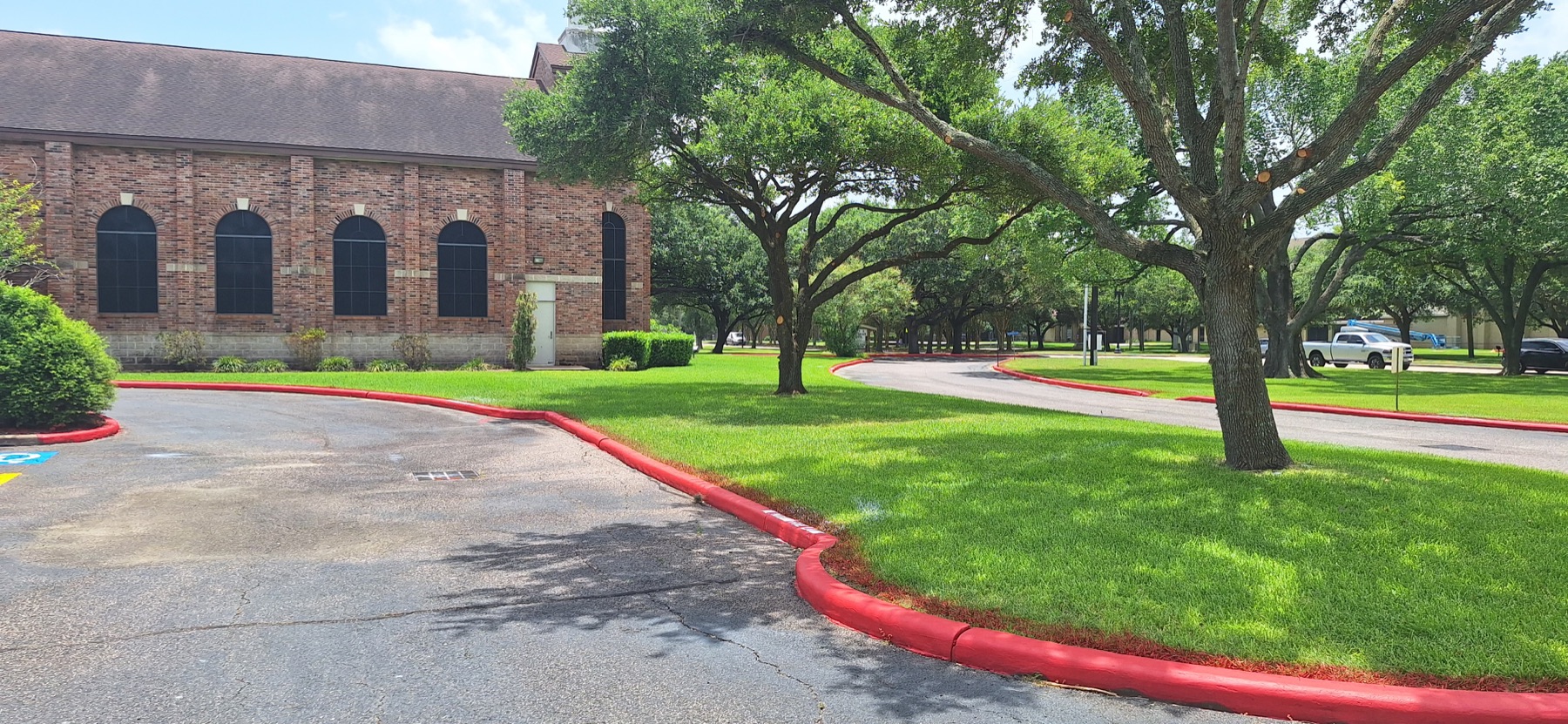 Red fire lane curb following the landscaped church drive